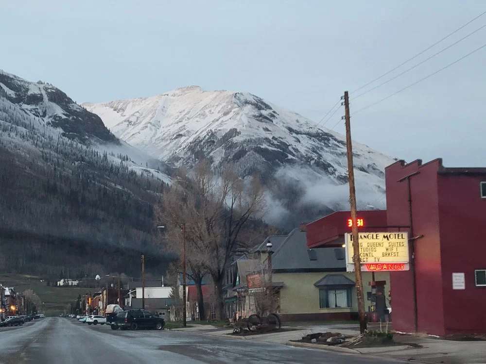 Triangle Motel exterior with mountain backdrop